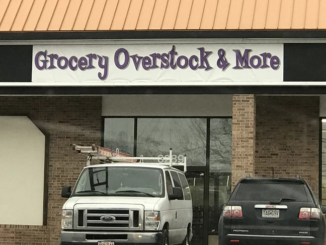 Grocery Overstock & More storefront sign