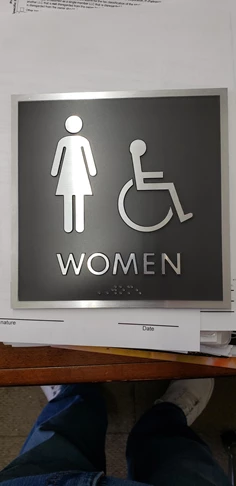 ADA | ADA Compliant Braille Signs | Manufacturing Signs | Kansas City, MO | Women's Restroom Sign | Bathroom Sign