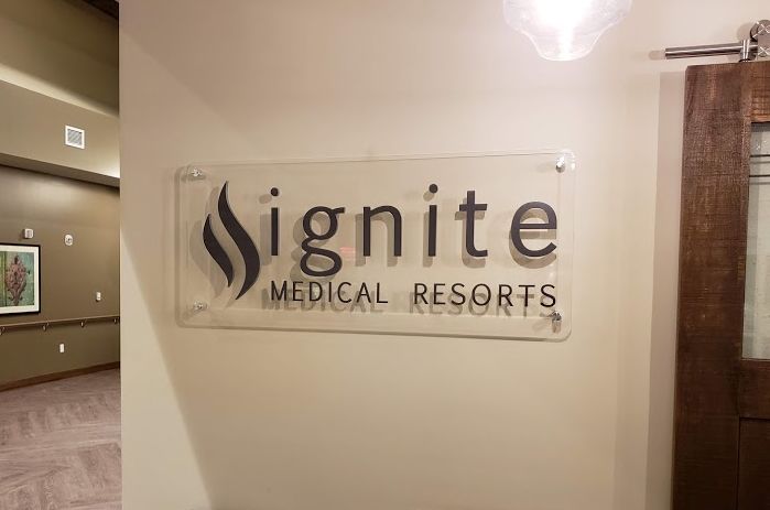 Interior acrylic standoff sign for medical resort