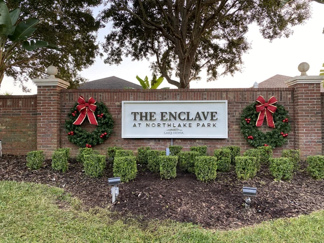 Exterior monument sign with brown logo on white background | Property Management Signs | Orlando, FL