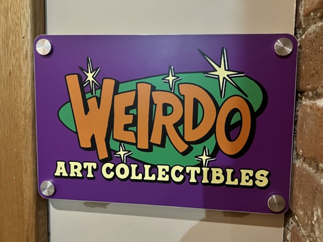 Custom Sign Printing | Retail Signs | Rockford, IL | Plastic | Weirdo Art Collectibles | Laura Gomel | 317 Art Collective | Rockford Area Arts Council Custom Sign Printing | Retail Signs | Rockford, IL | Plastic | Weirdo Art Collectibles | Laura Gomel | 317 Art Collective | Rockford Area Arts Council