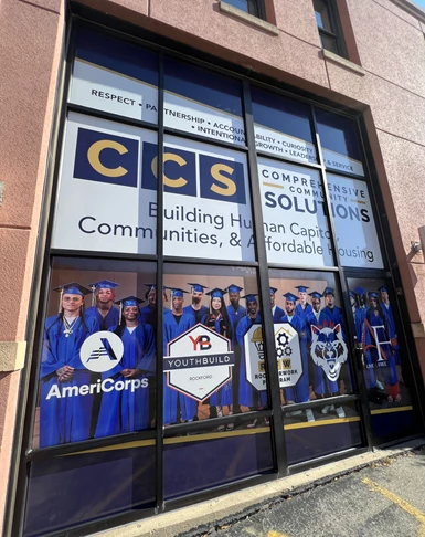 Window Graphics | Nonprofit Organizations and Associations Signs | Rockford, IL | Vinyl | Outdoor Window Graphics | Custom Graphics | Americorps | Youthbuild | Alpha Rockford | Comprehensive Community Solutions | Custom Decals | Wall Wraps 