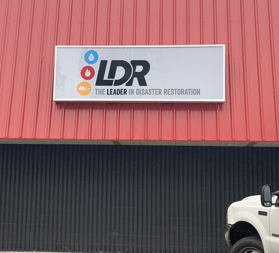 disaster restoration business storefront sign