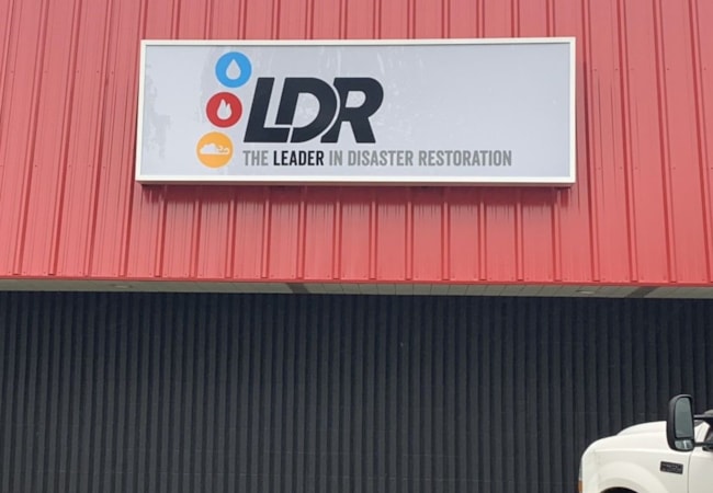 disaster restoration business storefront sign